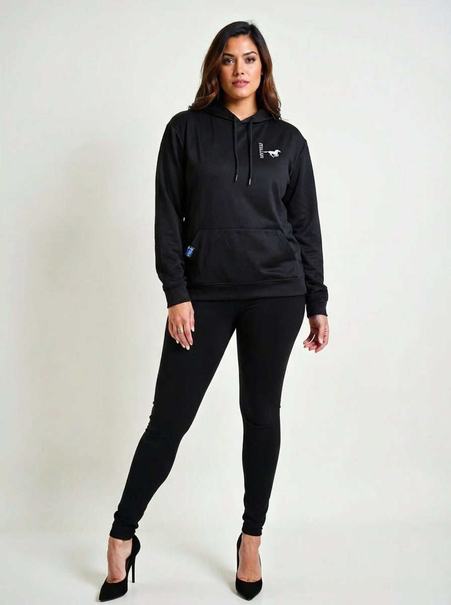 Woman wearing a black hoodie and pants branding a Silver Stallion