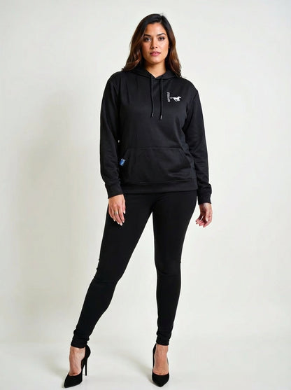 Woman wearing a black hoodie and pants branding a Silver Stallion